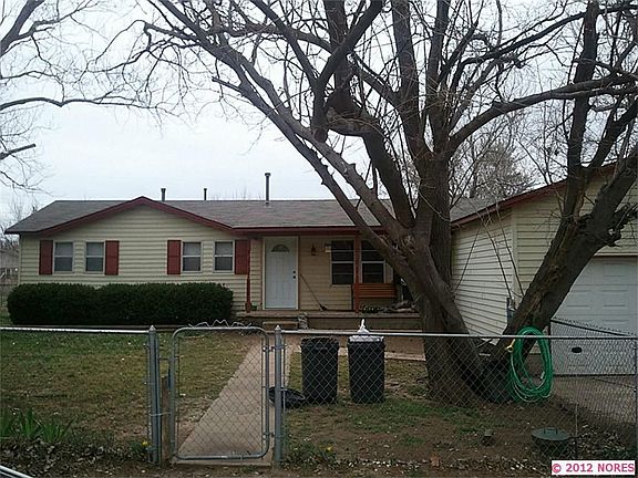 Exterior of home - Large fully fenced yard with mature trees.