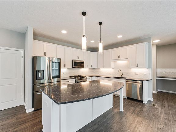 7 foot island with breakfast bar. Quartz counter tops.