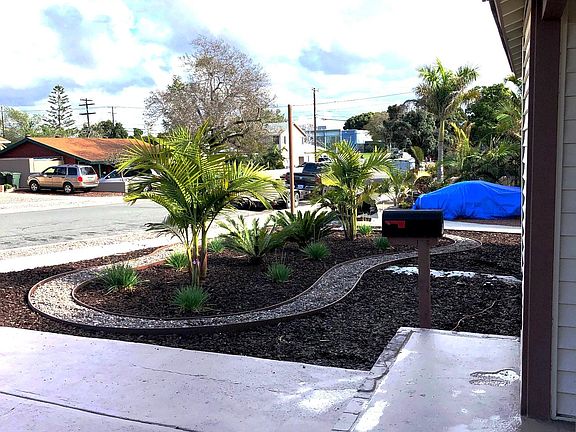 Front porch view of fully Landscaped low maintenance yard
