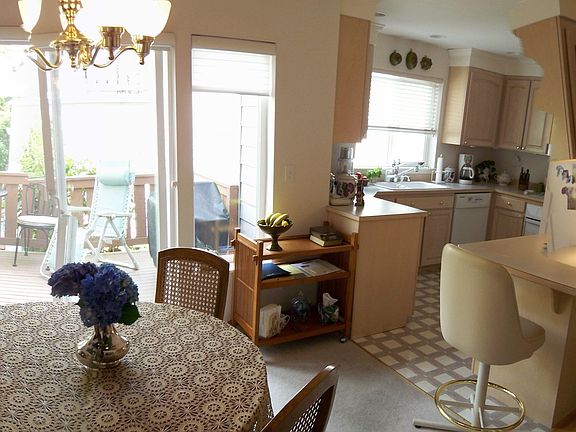 Bright Open Living Room with Vaulted Ceilings and Large Arched Windows