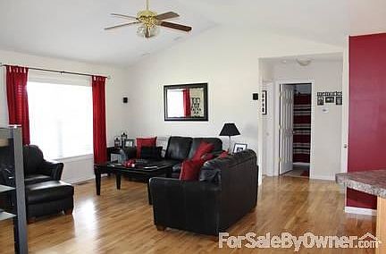 Living Room
						:
						Open floor plan with vaulted ceiling