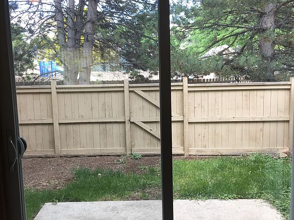 patio & fenced yard backing to greenbelt & Stonehenge Commun