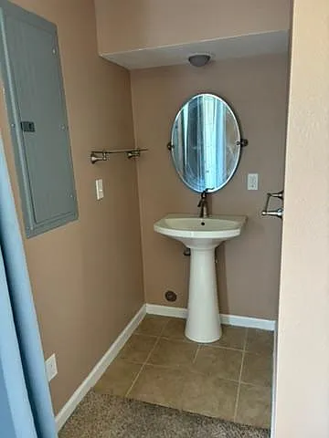Extra sink/mirror in basement bedroom