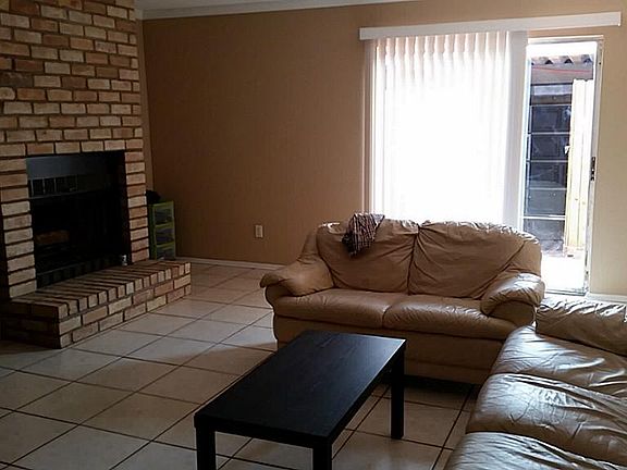 Fresh paint, wood burning fireplace, and built bar area. Sliding glass doors leads to patio and gara