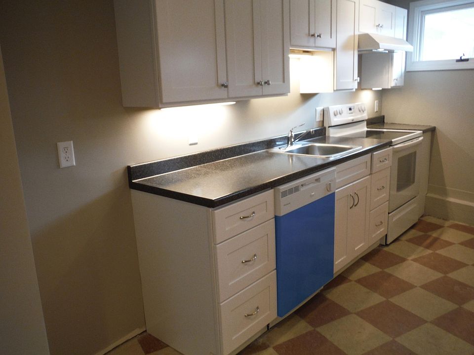 All new white kitchen with dishwasher.