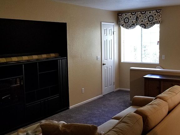 Living room and top of stairs.