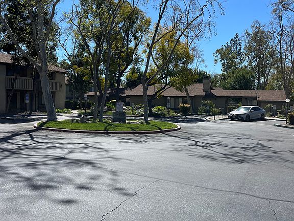 Beyond the gate, building with laundry facility. Pool/spa behind the building