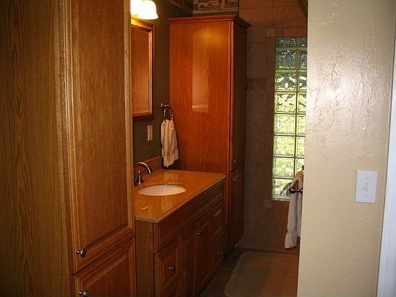 Granite vanity top with hickory cabinets