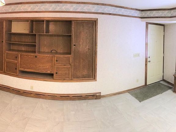 Beautiful built-ins and window bench in the dining area that is open to the kitchen