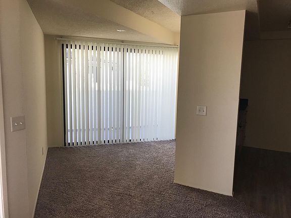 Dining area with large sliding glass door leading to balcony