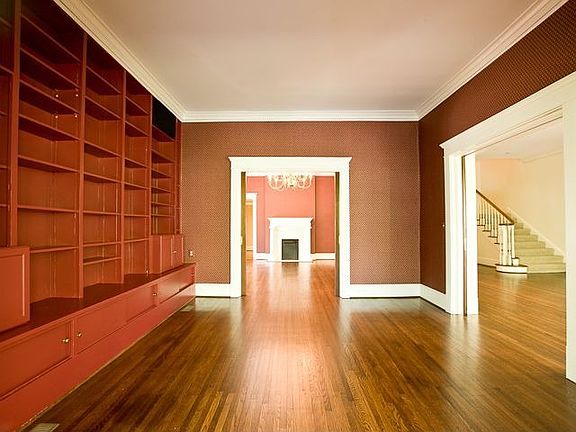 THE LIBRARY OPENS TO THE DINING ROOM & FORMAL LIVING ROOM