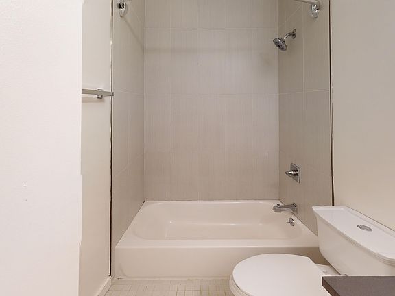 Bathroom with a toilet and bathtub
