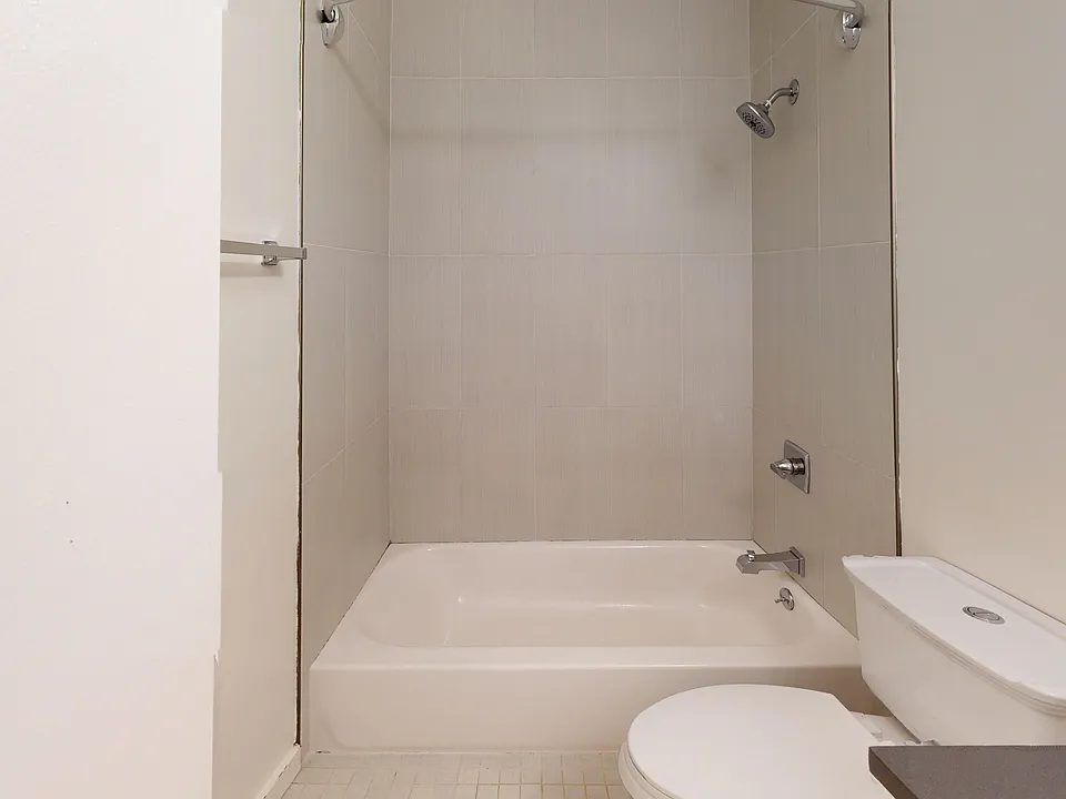 Bathroom with a toilet and bathtub