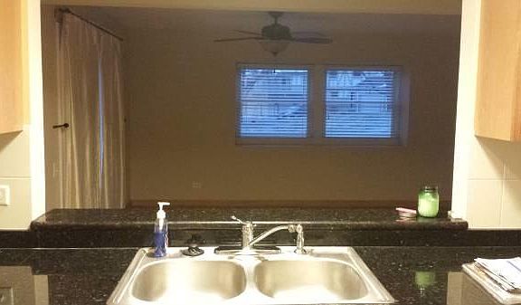 Kitchen looking into eating area/family room