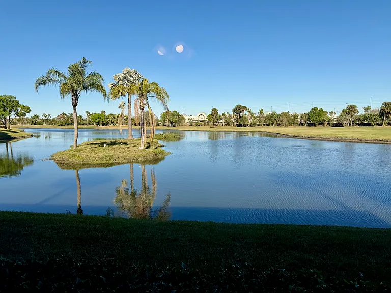 STUNNING lake and golf views to enjoy from the living room & primary bedroom!