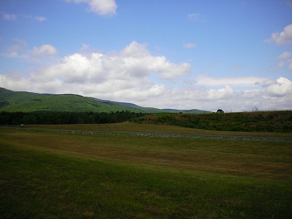 Lot has several nice and flat building sites located on it!!