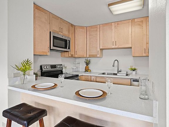 Seating for 3 at the island.