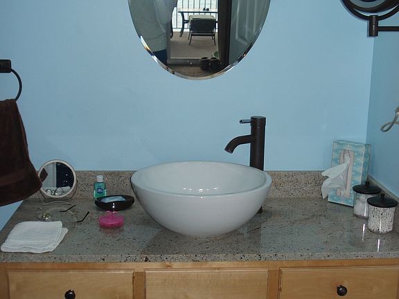 Granite counters & vessel sinks in bths