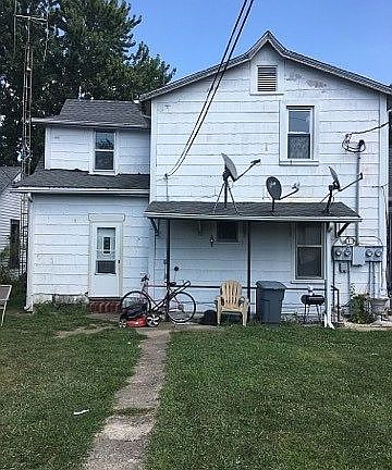 from the alley in the rear