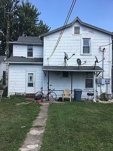 from the alley in the rear