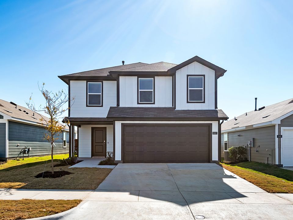 View of front of home featuring concrete driveway, board and batten siding, a shingled roof, and an attached garage