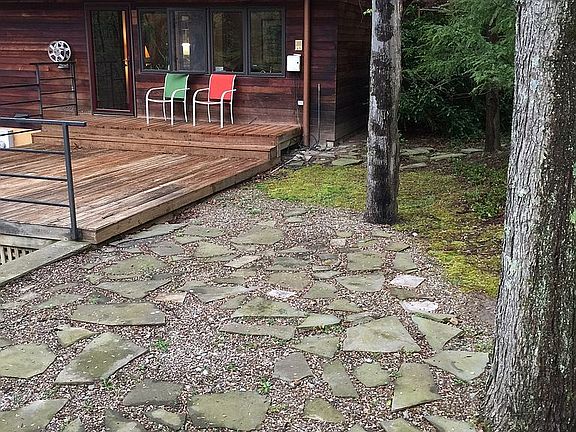 East patio, deck and bedroom