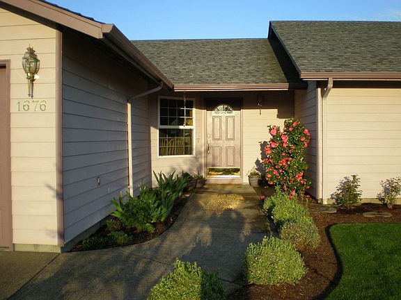 Covered entry, more flowers.