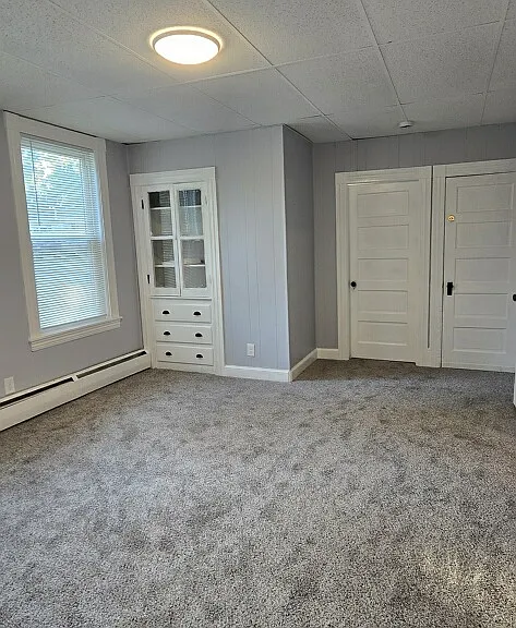 Large livingroom easily can fit a sectional.
Charming built-ins