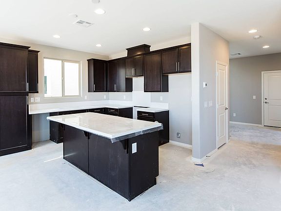 Homesite 50 kitchen has lovely stained maple cabinetry