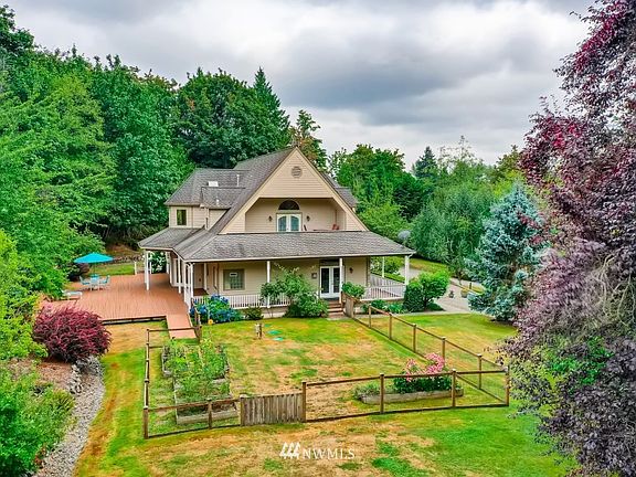 Northwest side of the home, with a wrap around deck.  