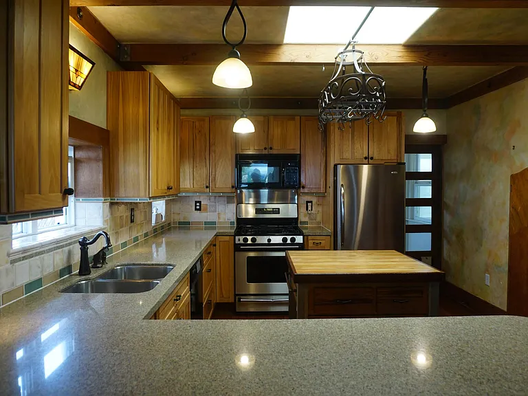 From Dining Island to the Kitchen and Door to the Sunroom.