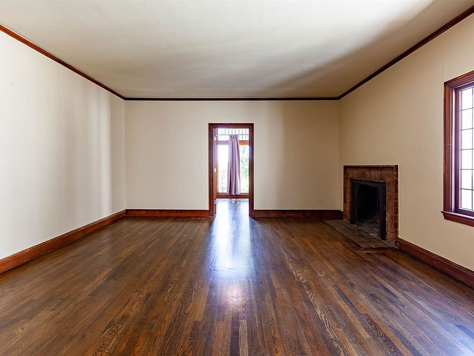 Expansive formal living room with fire place and sliding doo