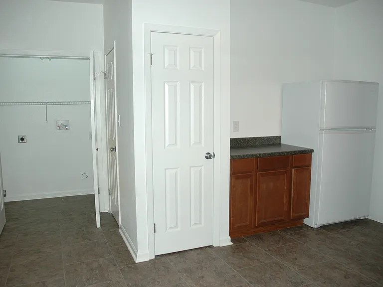 Kitchen, pantry, and laundry closet.