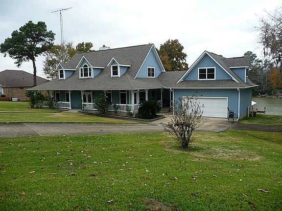 Beautiful waterfront home that has game room or living quarters above attached garage
