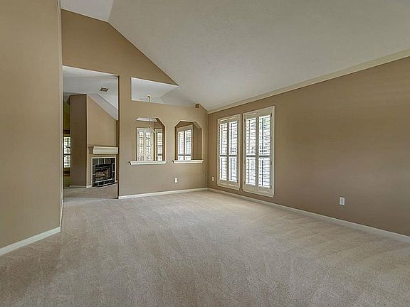 Very large formal living room with extra high ceilings.