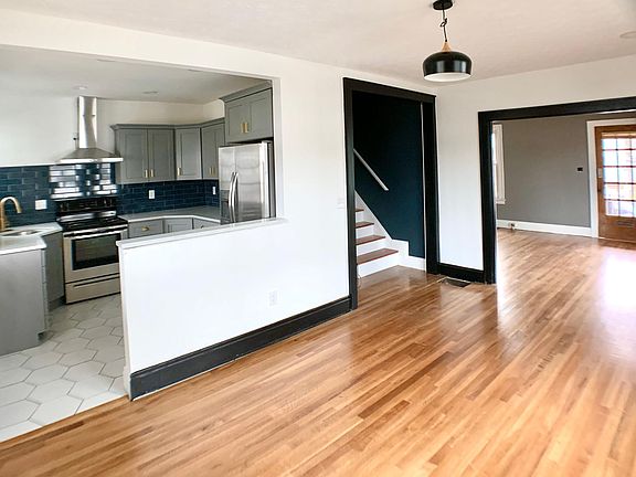 Dining room looks into kitchen