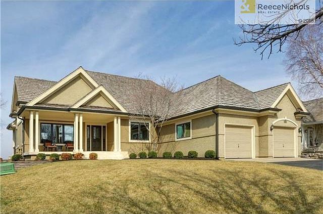 Charming reverse 1.5 story on the golf course!