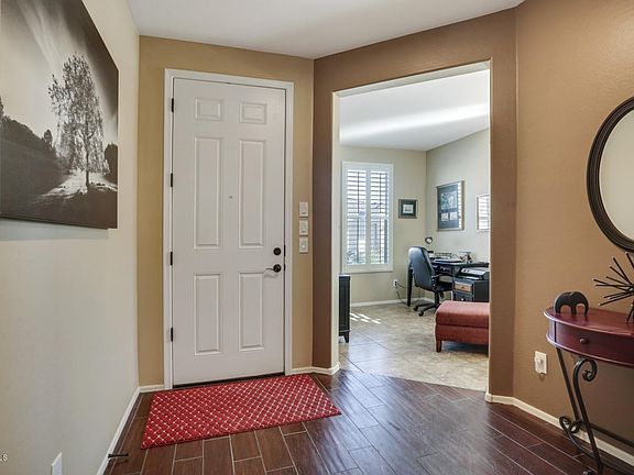 Foyer flanked by Den