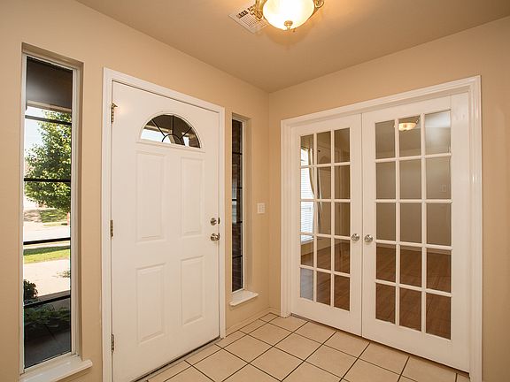 CENTER HALL ENTRY, LOOKING AT ATRIUM DOOR TO XLARGE FORMAL LIVING