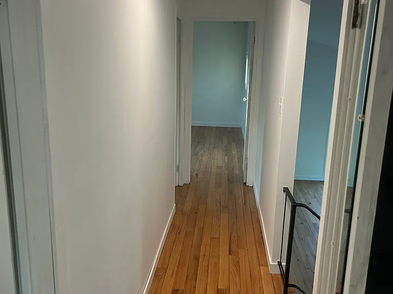 upstairs hallway that connects all three bedrooms