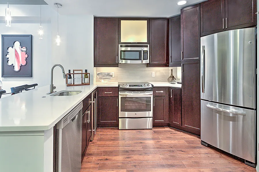 Kitchens with Quartz countertops and stainless steel appliances