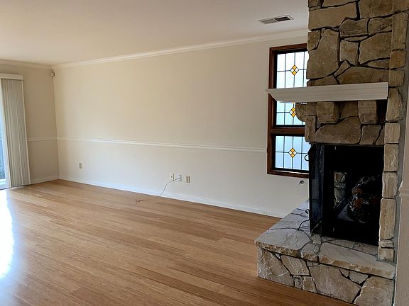 Bamboo wide-plank flooring throughout the spacious living area