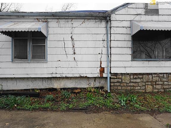 SIDE OF HOME WITH VIEW OF FOUNDATIONS