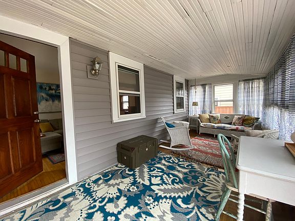 Front screened in porch is great to relax and enjoy Minnesota evenings.