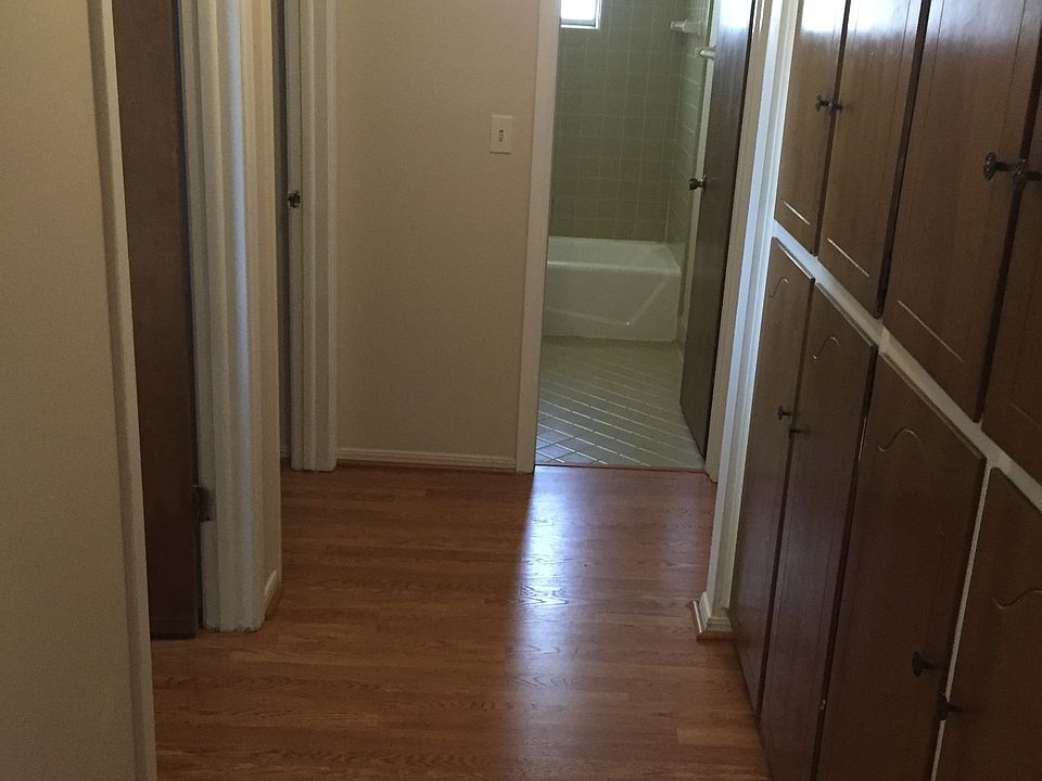 hallway to the bedrooms with closet in the side