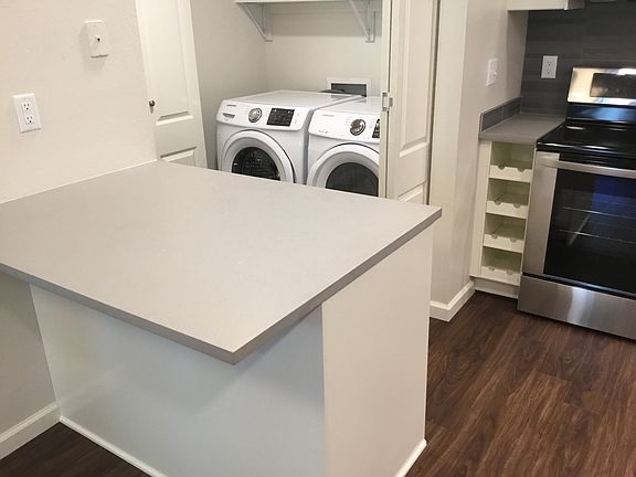 Kitchen island with space for bar stools or preparing meals.