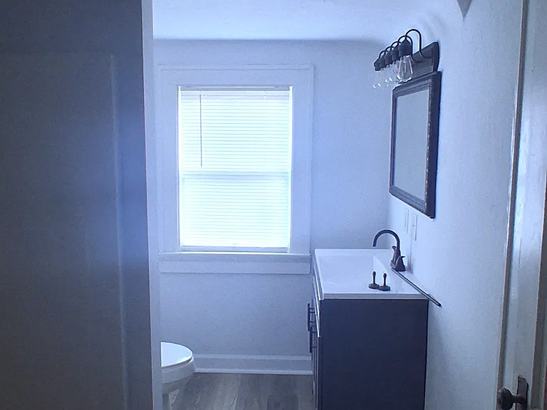 Bathroom, new vanity, new sink and plumbing, new flooring.