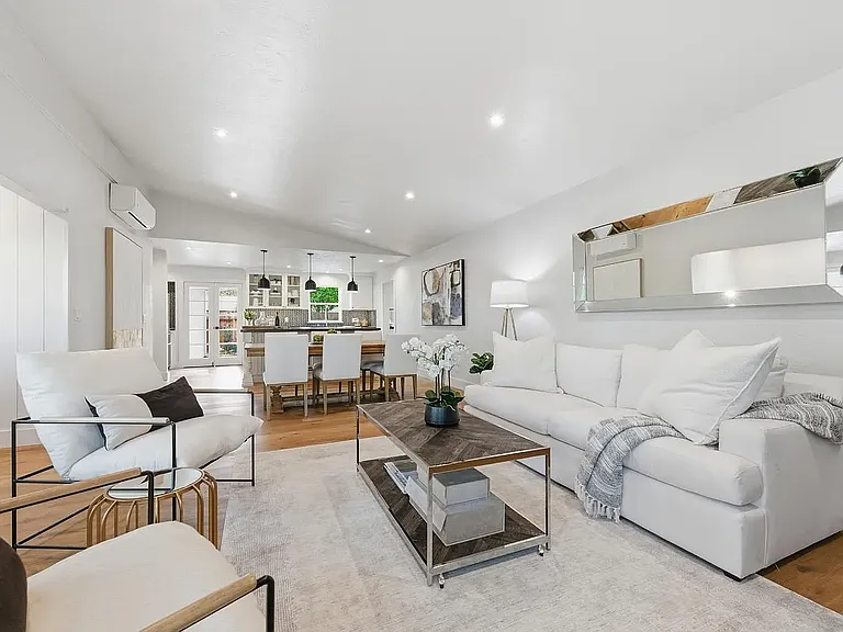 Living room, reverse view into kitchen, open concept