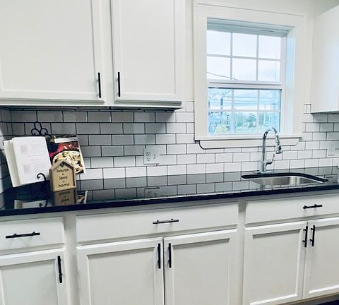 Renovated Kitchen with new cabinets, subway tile and granite counter tops!