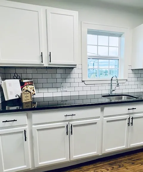 Renovated Kitchen with new cabinets, subway tile and granite counter tops!